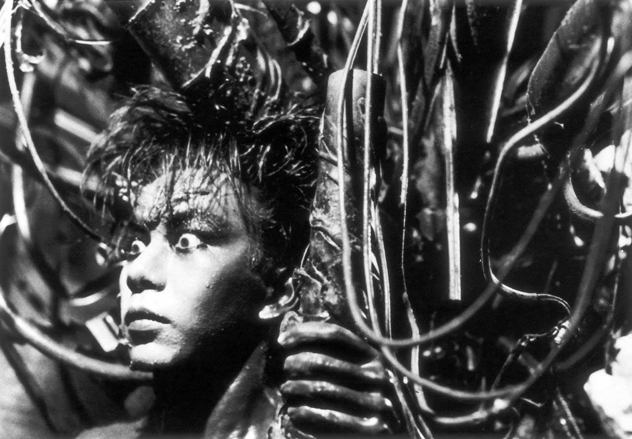 man covered in machinery from tetsuo the iron man